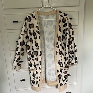This cheetah cardigan is perfect as a throw on for when your cold.